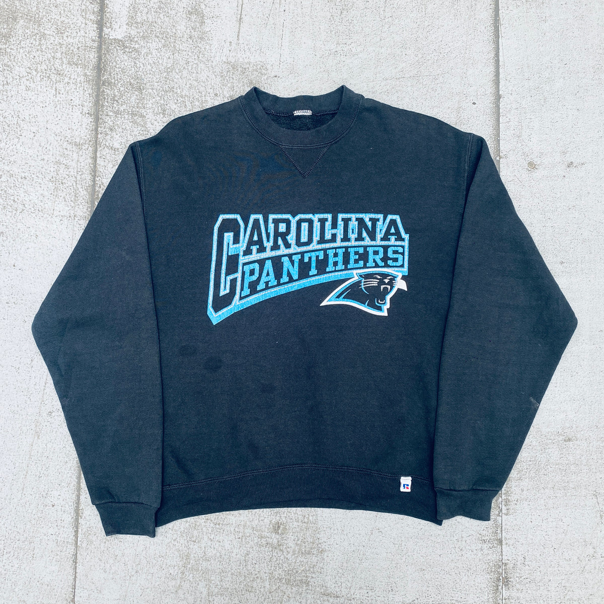 Carolina Panthers: 1990's Russell Athletic Graphic Spellout Sweat