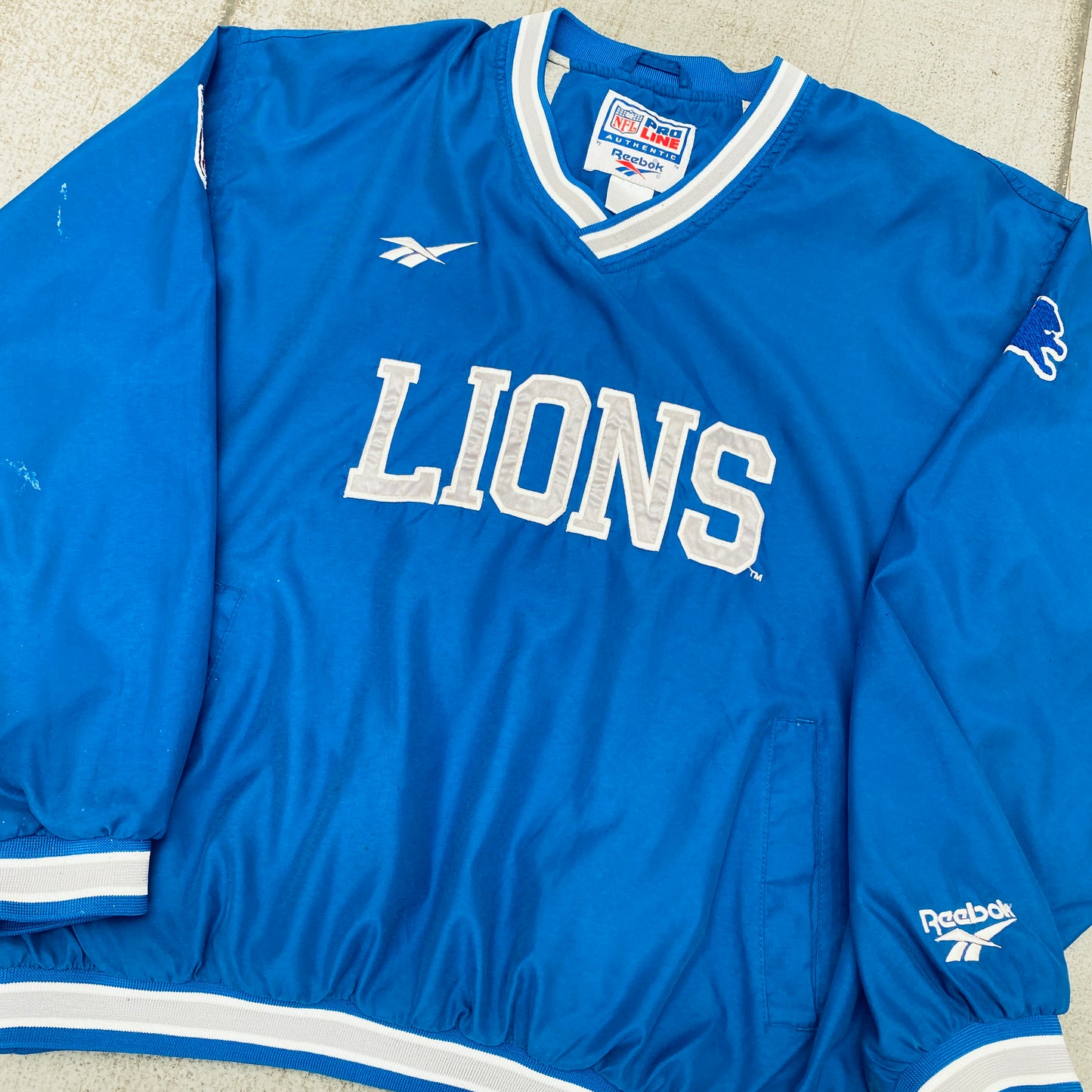 Detroit Lions: 1990's Reebok Embroidered Spellout Proline Sideline Jacket (L/XL)