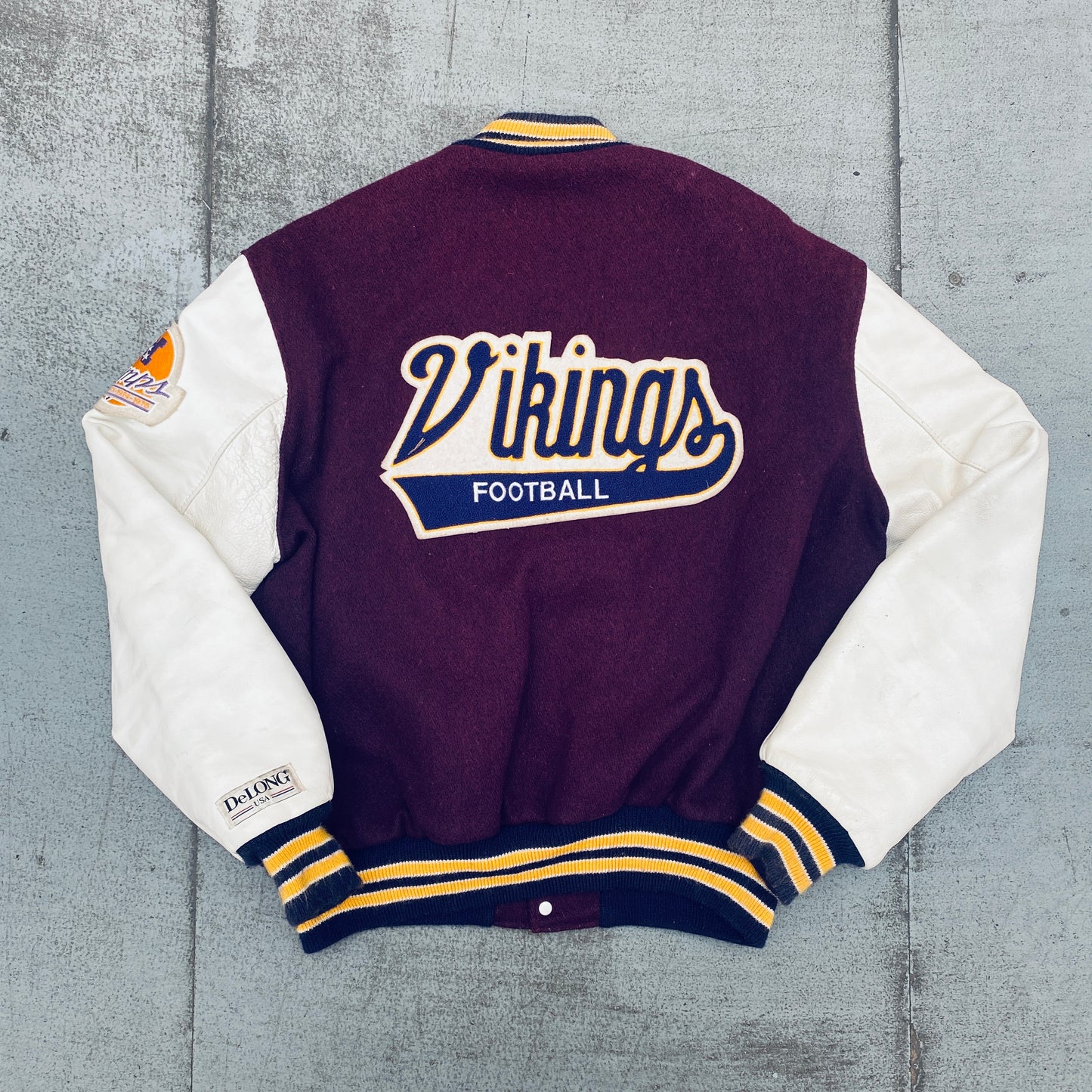 Minnesota Vikings: 1980's DeLong Leather Sleeve Woollen Varsity Jacket w/ NFC Champs Patch (L)