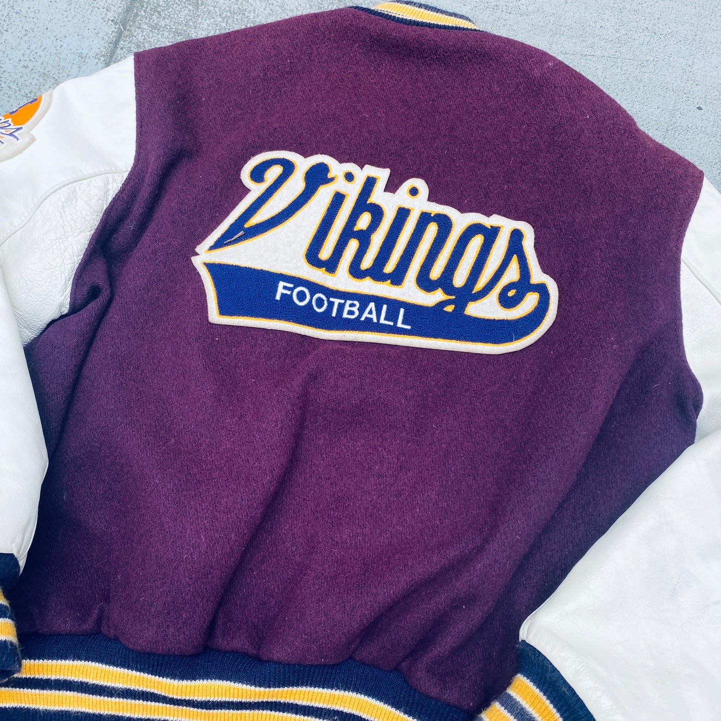 Minnesota Vikings: 1980's DeLong Leather Sleeve Woollen Varsity Jacket w/ NFC Champs Patch (L)