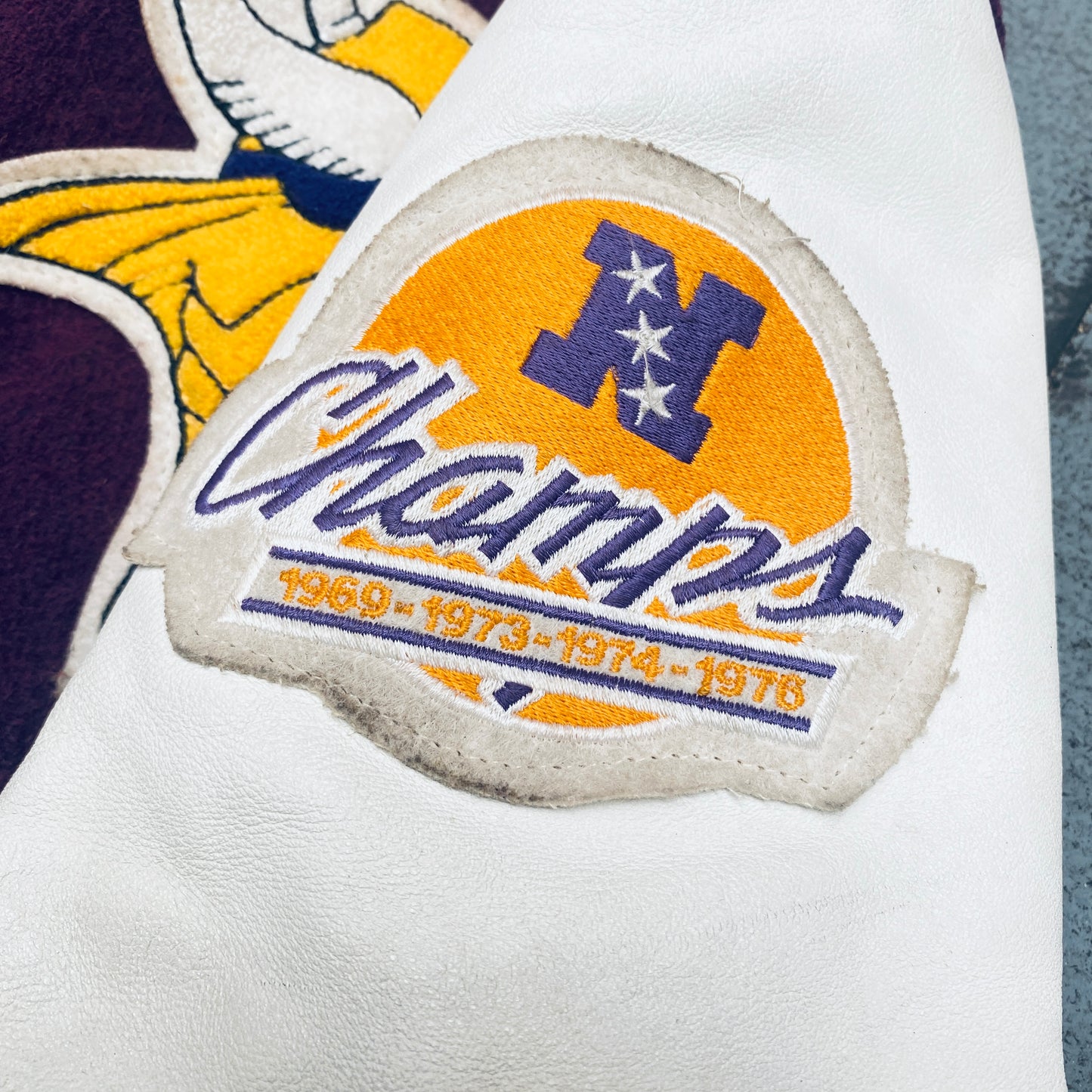 Minnesota Vikings: 1980's DeLong Leather Sleeve Woollen Varsity Jacket w/ NFC Champs Patch (L)