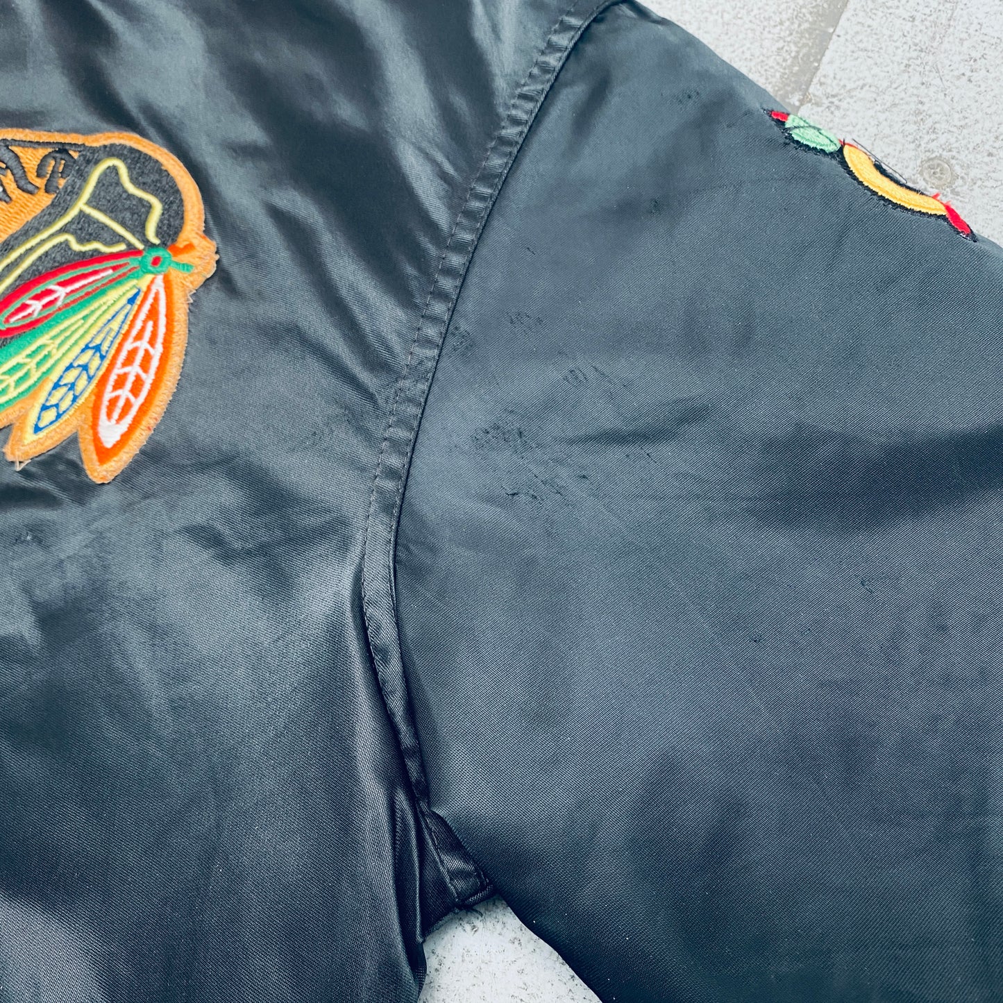 Chicago Blackhawks: 1980's Blackout Satin Starter Bomber Jacket (L)