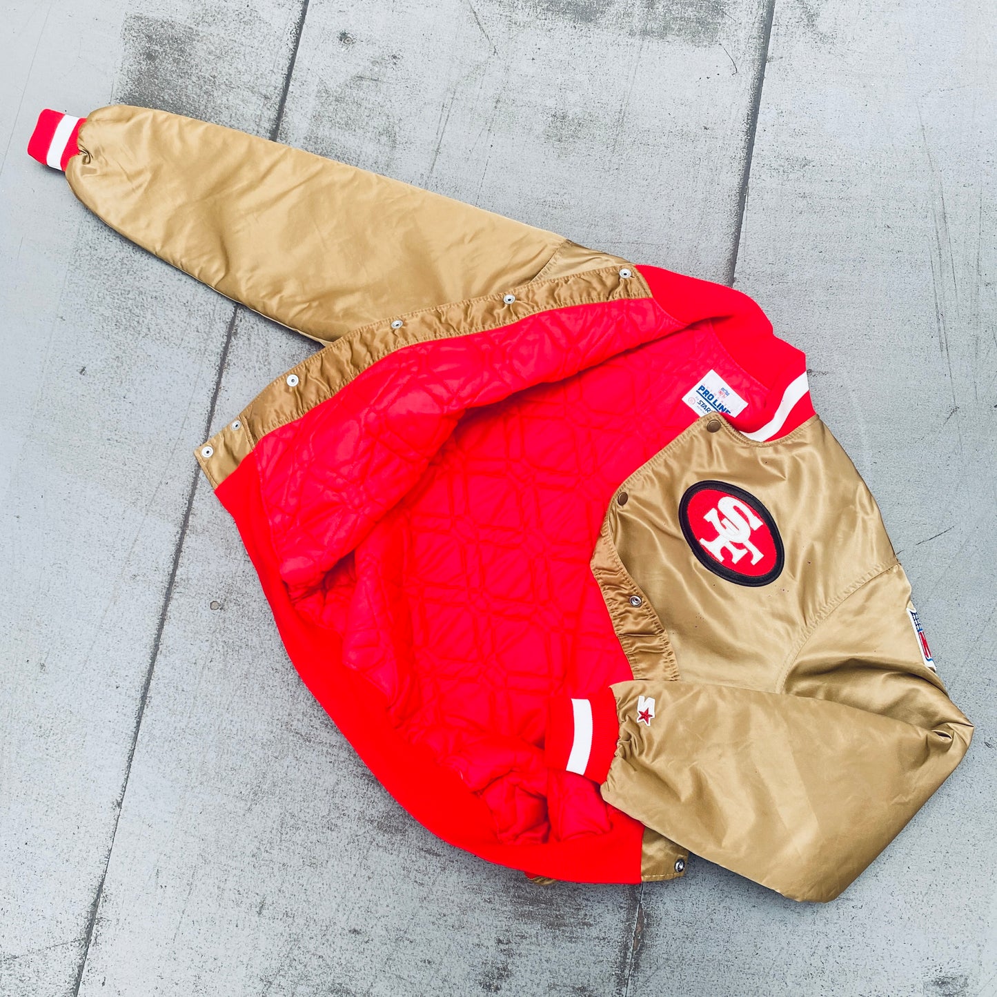 San Francisco 49ers: 1980's Satin Reverse Spellout Proline Starter Bomber Jacket (XL)