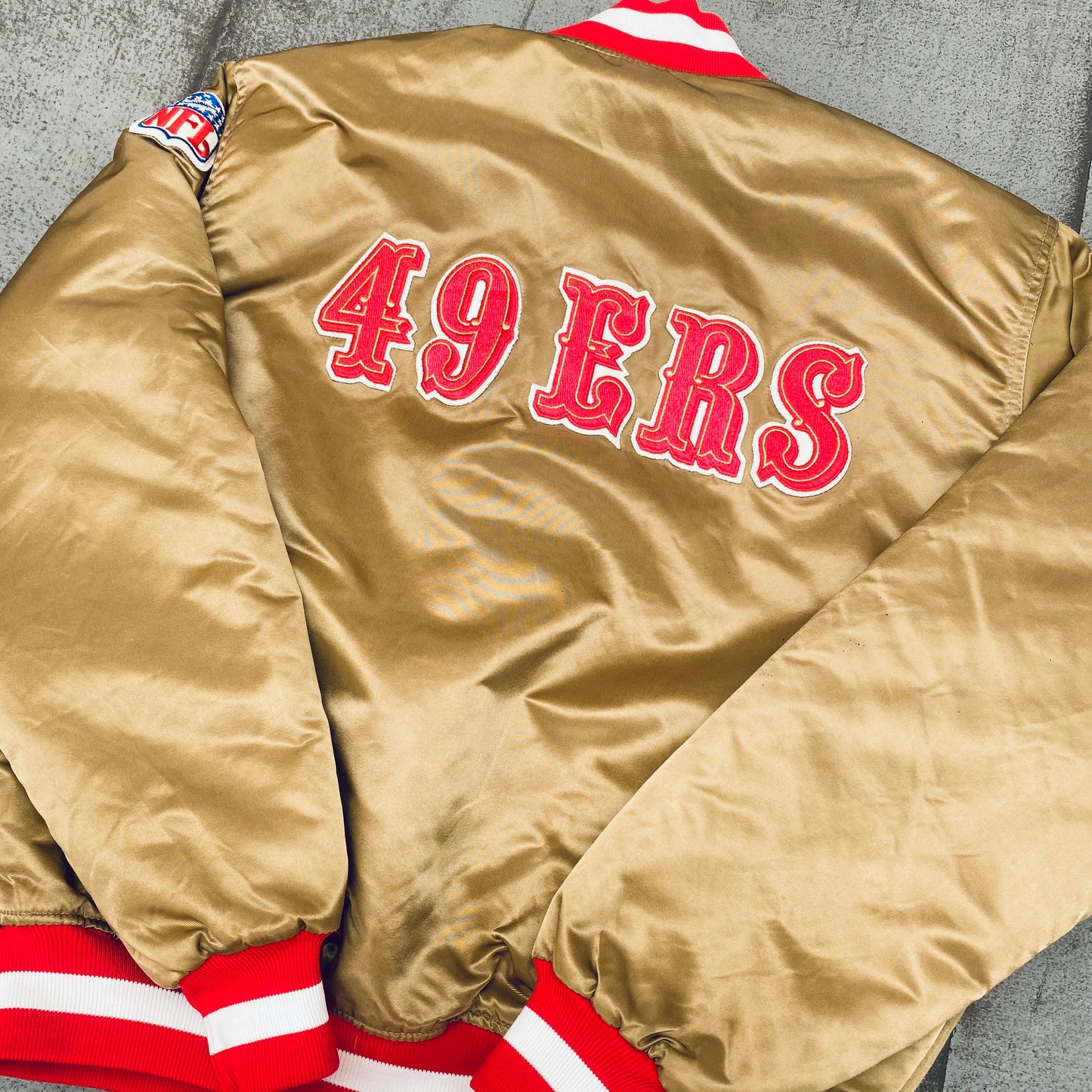 San Francisco 49ers: 1980's Satin Reverse Spellout Proline Starter Bomber Jacket (XL)