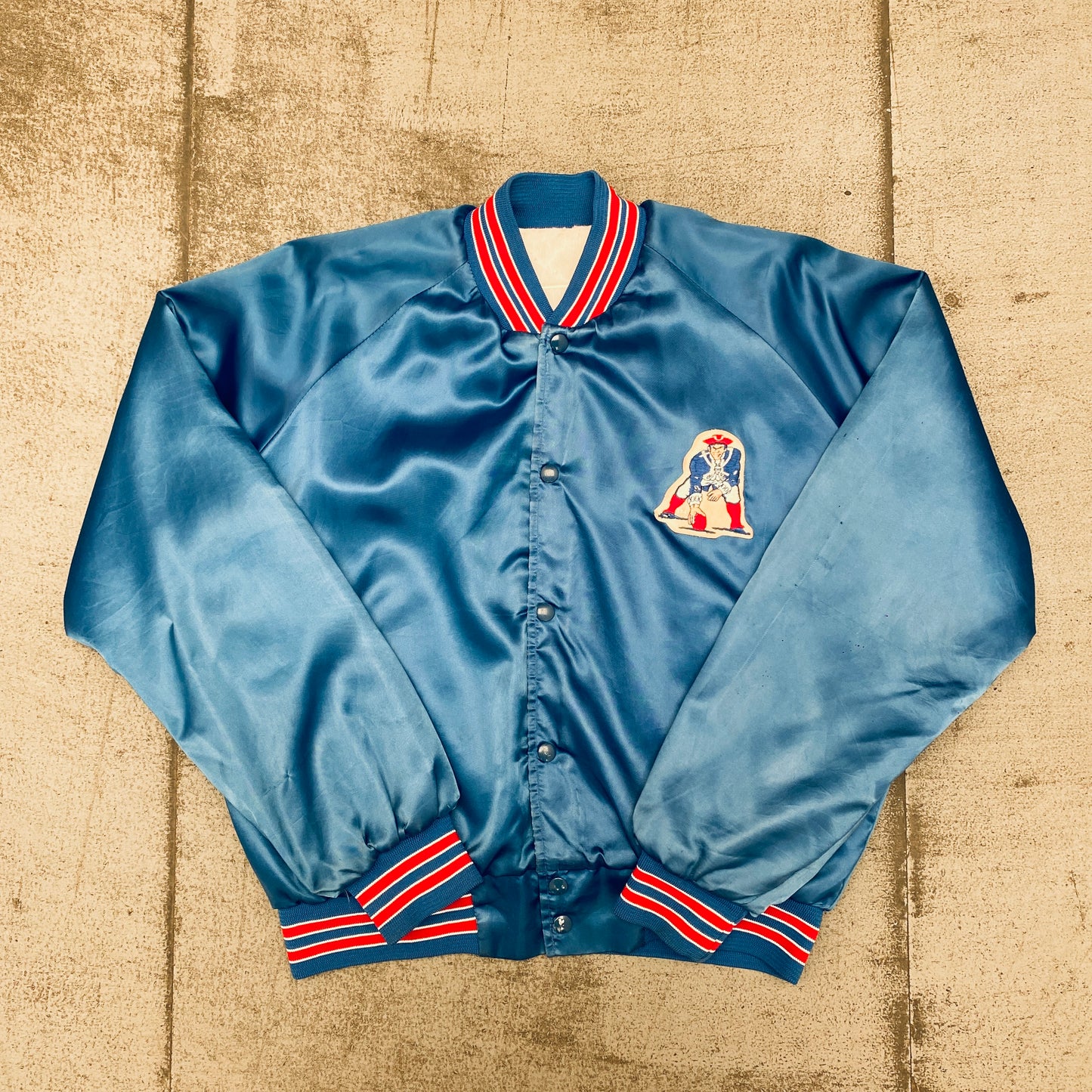 New England Patriots: 1980's Chalk Line Satin "Pat Patriot" Bomber Jacket (L)