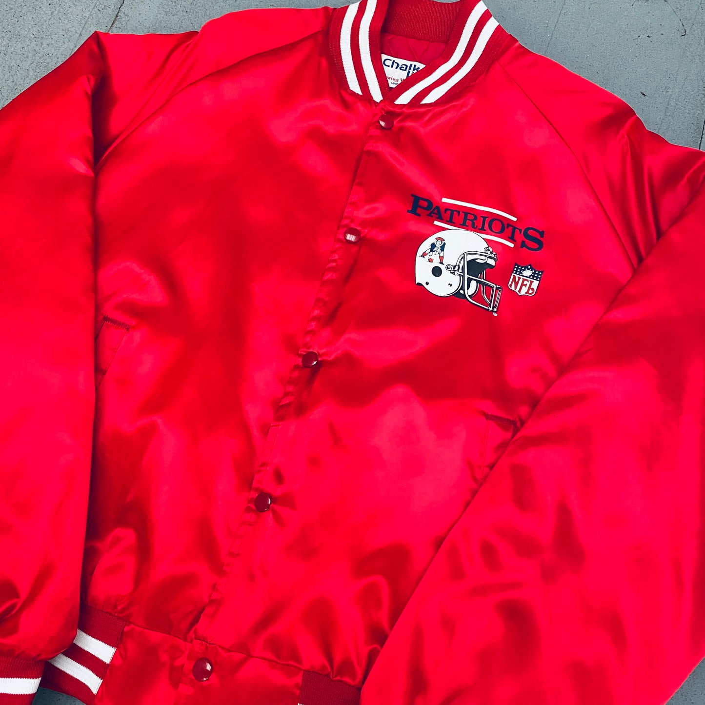 New England Patriots: 1980's Chalk Line Satin Reverse Spellout Bomber Jacket (XL)