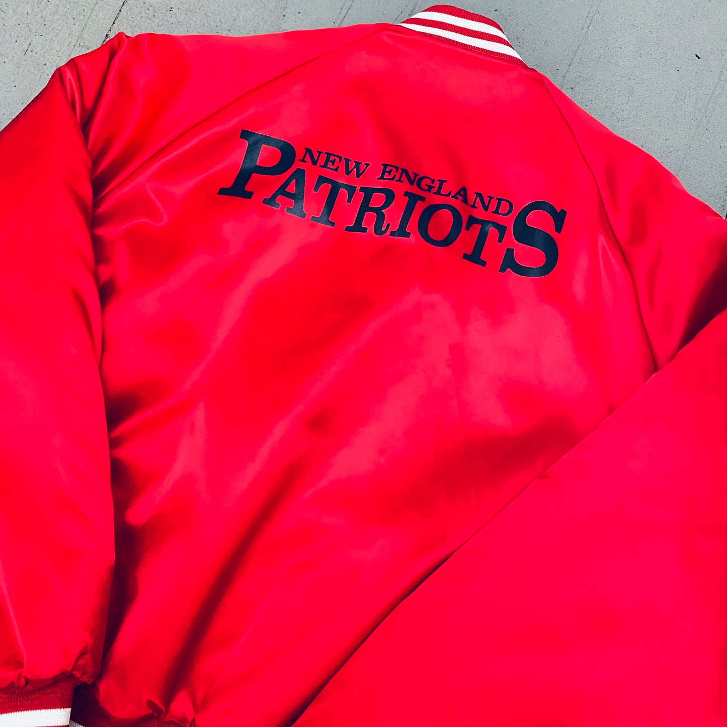 New England Patriots: 1980's Chalk Line Satin Reverse Spellout Bomber Jacket (XL)