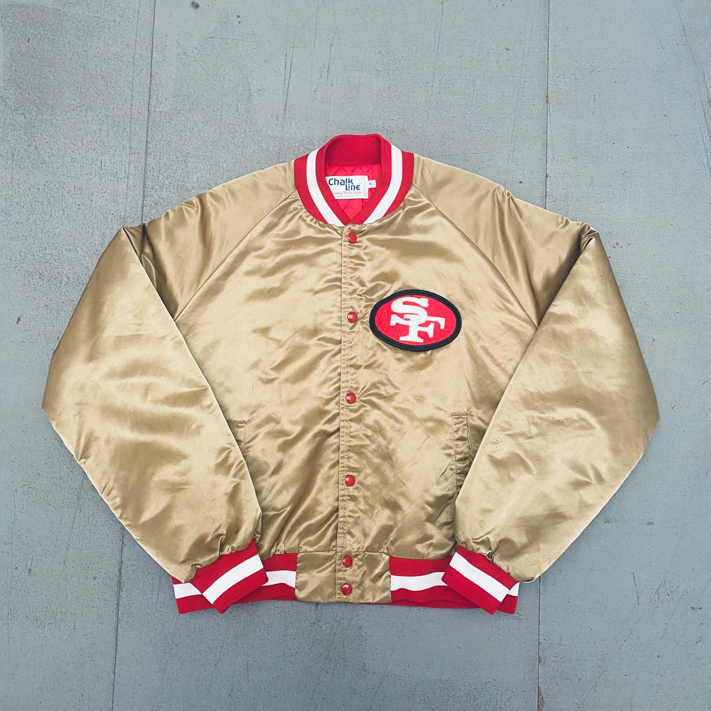 San Francisco 49ers: 1980's Chalk Line Satin Reverse Stitched Spellout Bomber Jacket (XL)