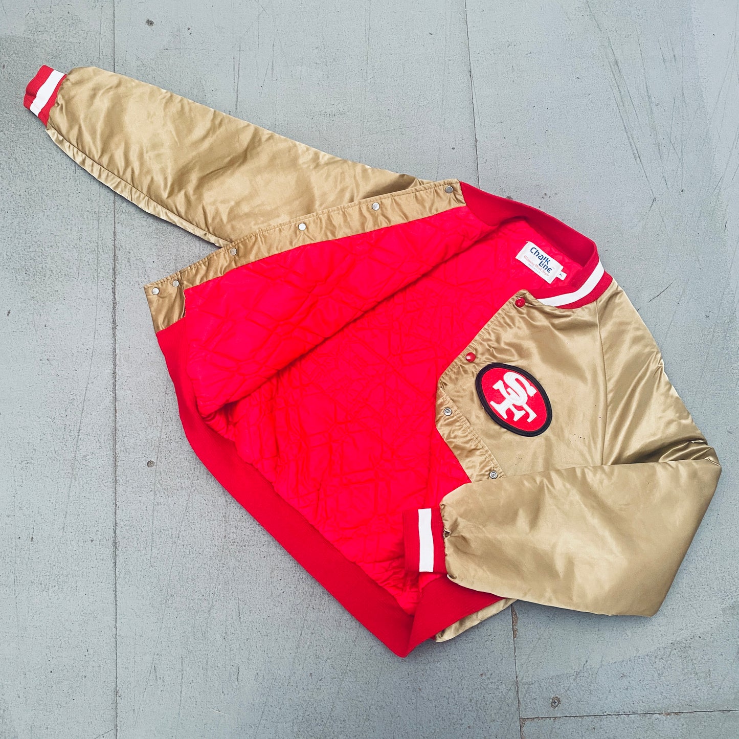 San Francisco 49ers: 1980's Chalk Line Satin Reverse Stitched Spellout Bomber Jacket (XL)