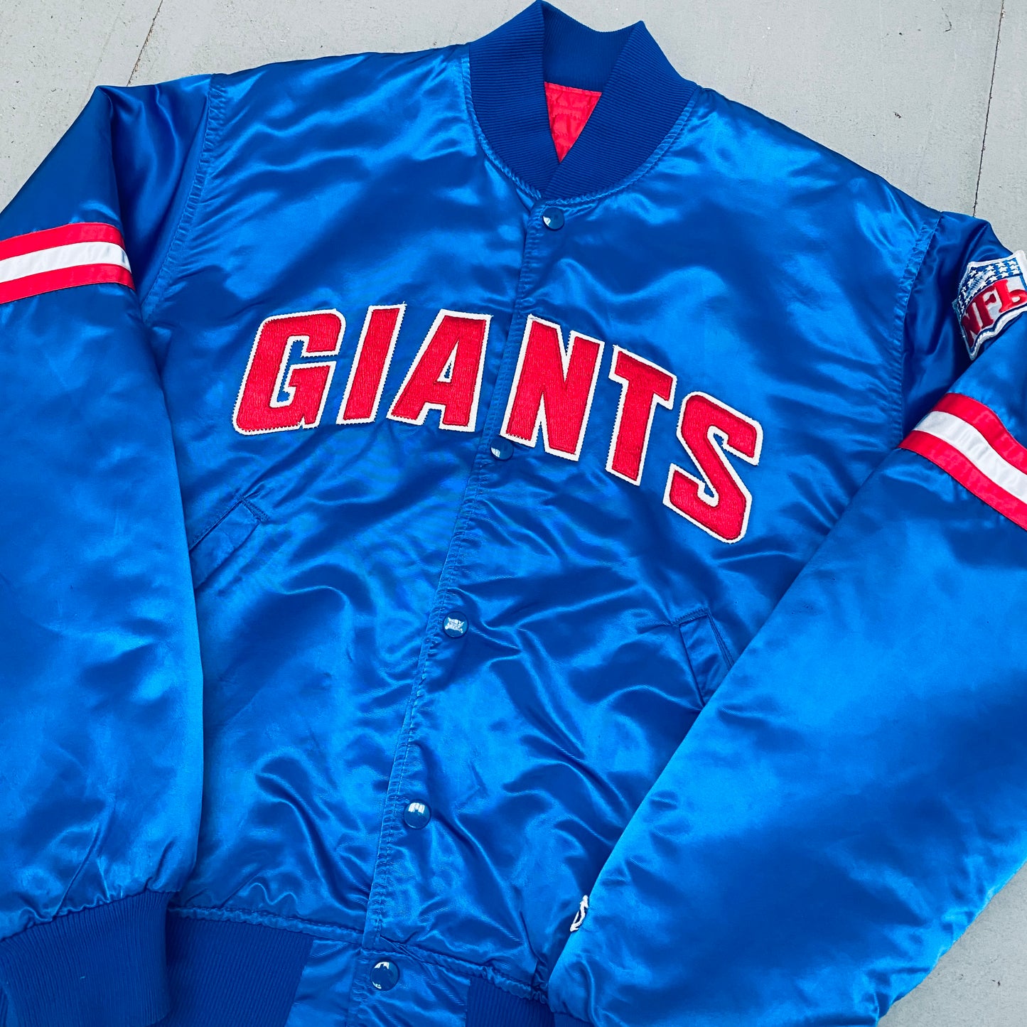 New York Giants: 1980's Satin Spellout Starter Bomber Jacket (L)