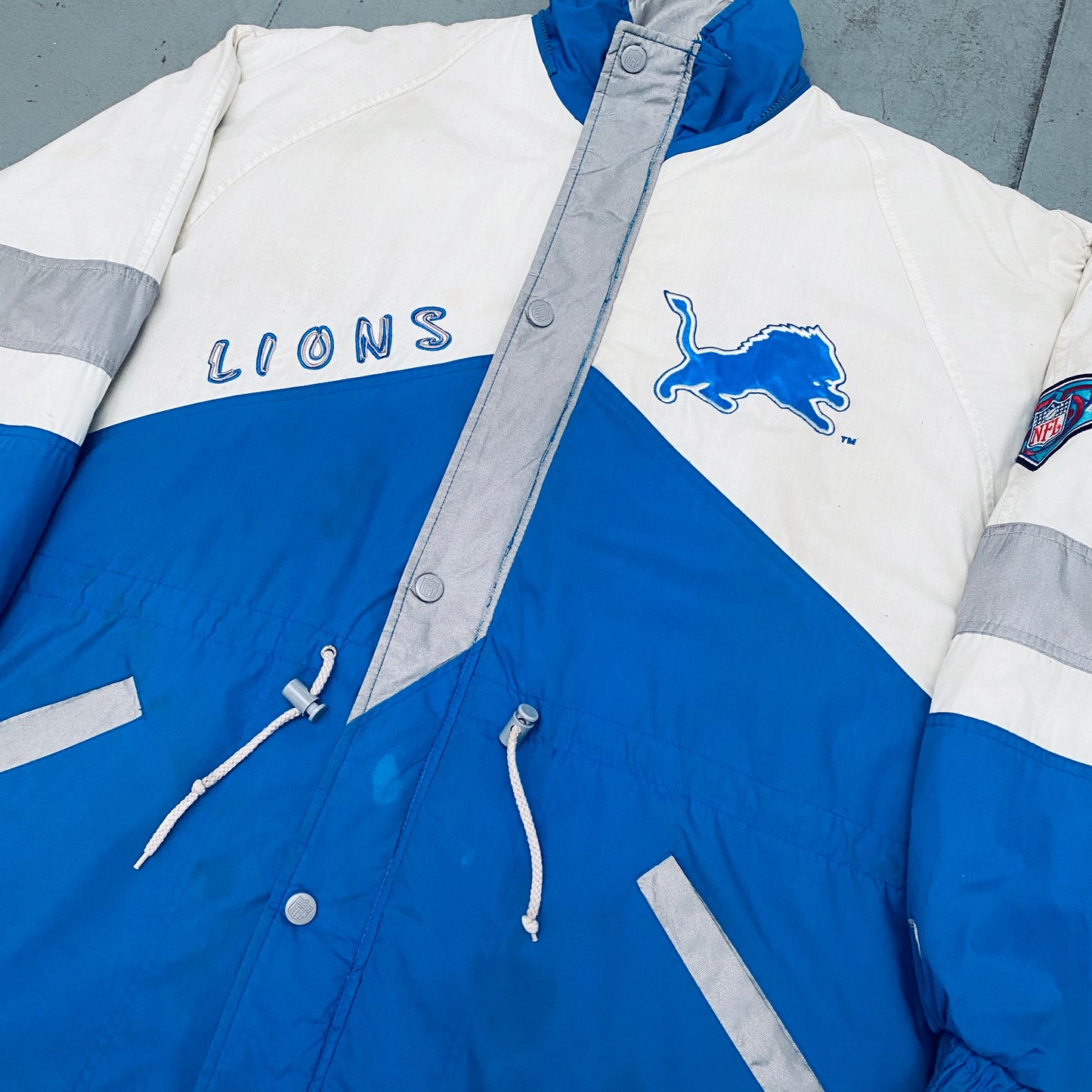 Detroit Lions: 1994 Pro Player HUGE Graffiti Spellout Fullzip Trench Coat w/ 75th Anniversary Patch (L)