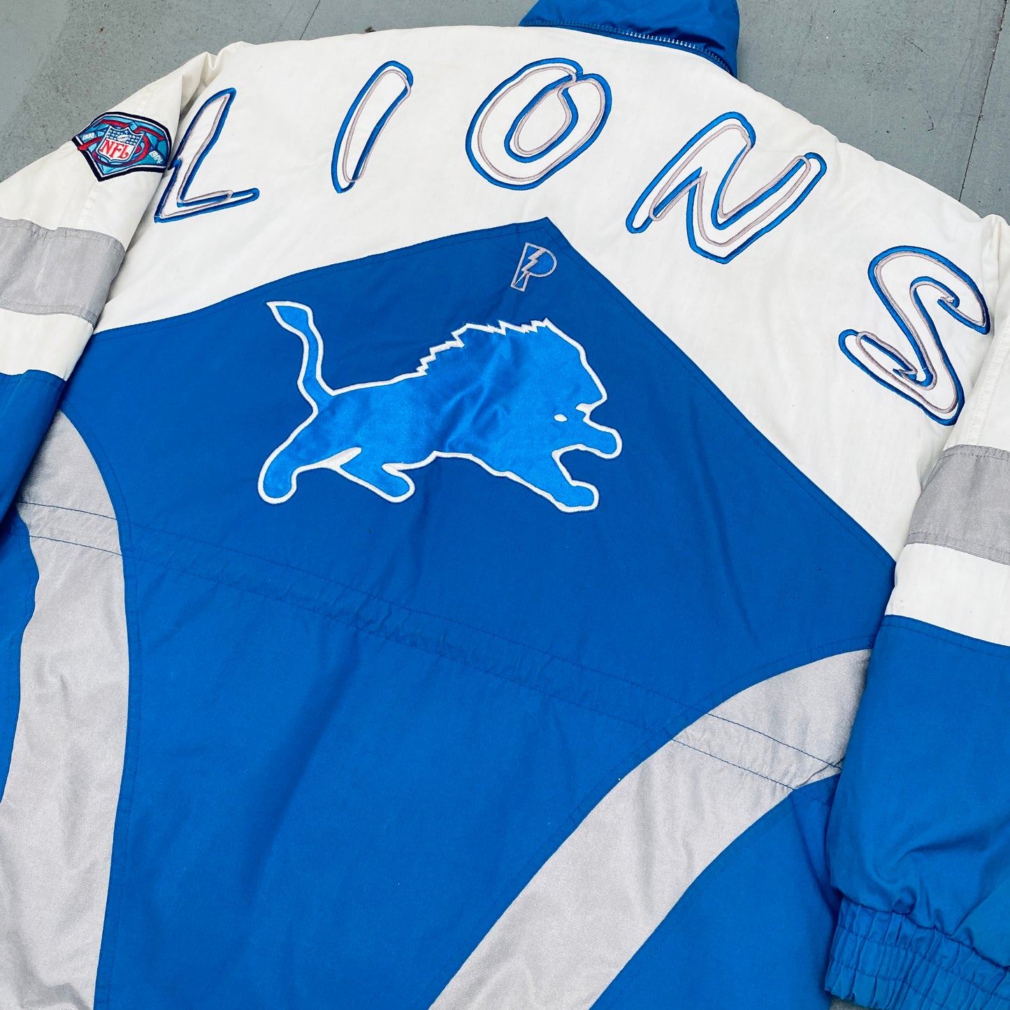 Detroit Lions: 1994 Pro Player HUGE Graffiti Spellout Fullzip Trench Coat w/ 75th Anniversary Patch (L)