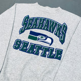 Seattle Seahawks: 1990's Logo 7 Graphic Spellout Sweat (L)