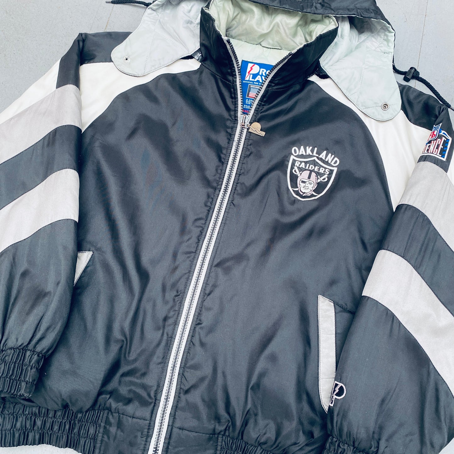 Oakland Raiders: 1990's Pro Player Reverse Spellout Fullzip Jacket (XL)