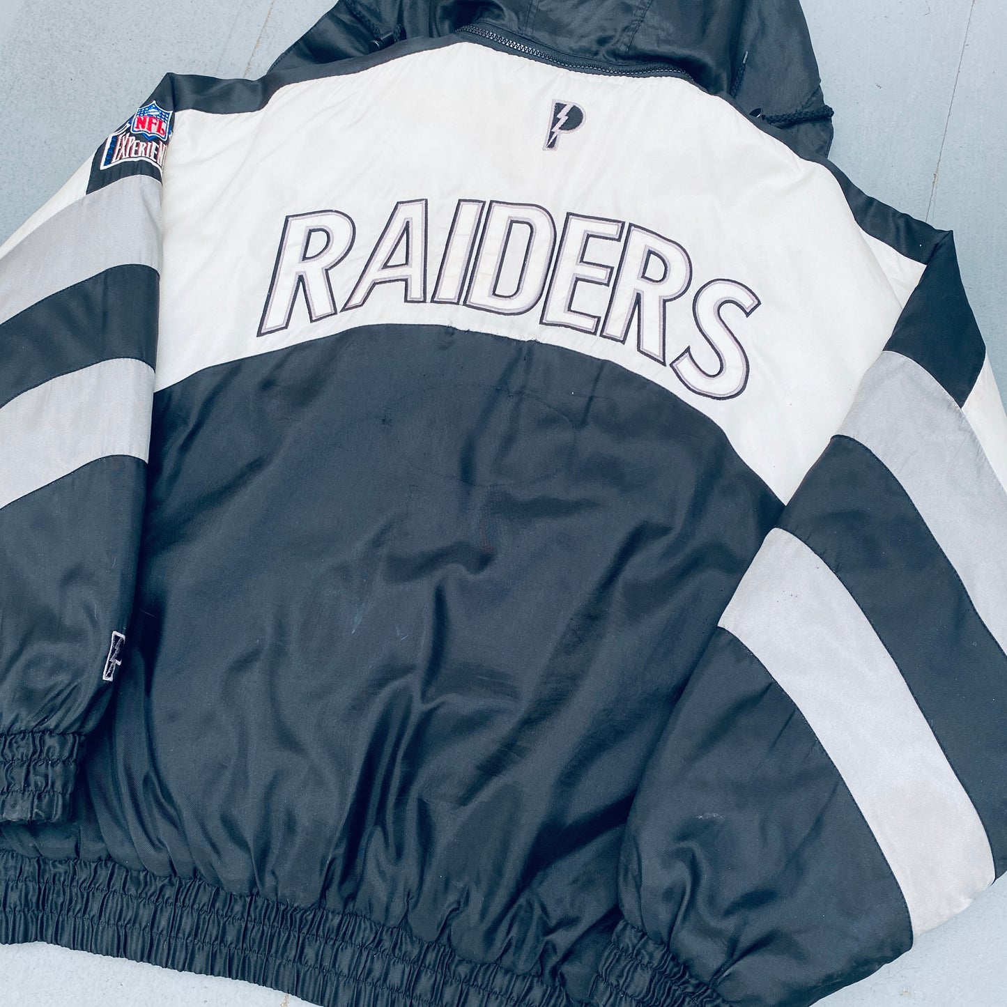 Oakland Raiders: 1990's Pro Player Reverse Spellout Fullzip Jacket (XL)