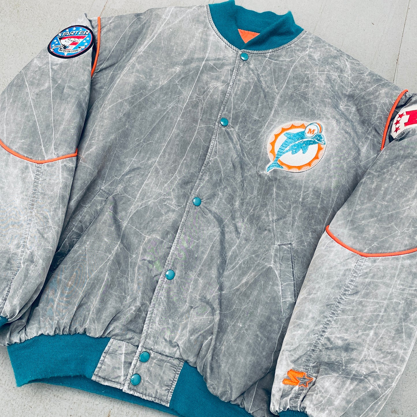 Miami Dolphins: 1990's Reverse Spellout Stone Wash Starter Bomber Jacket w/ NASA Patch (XL)