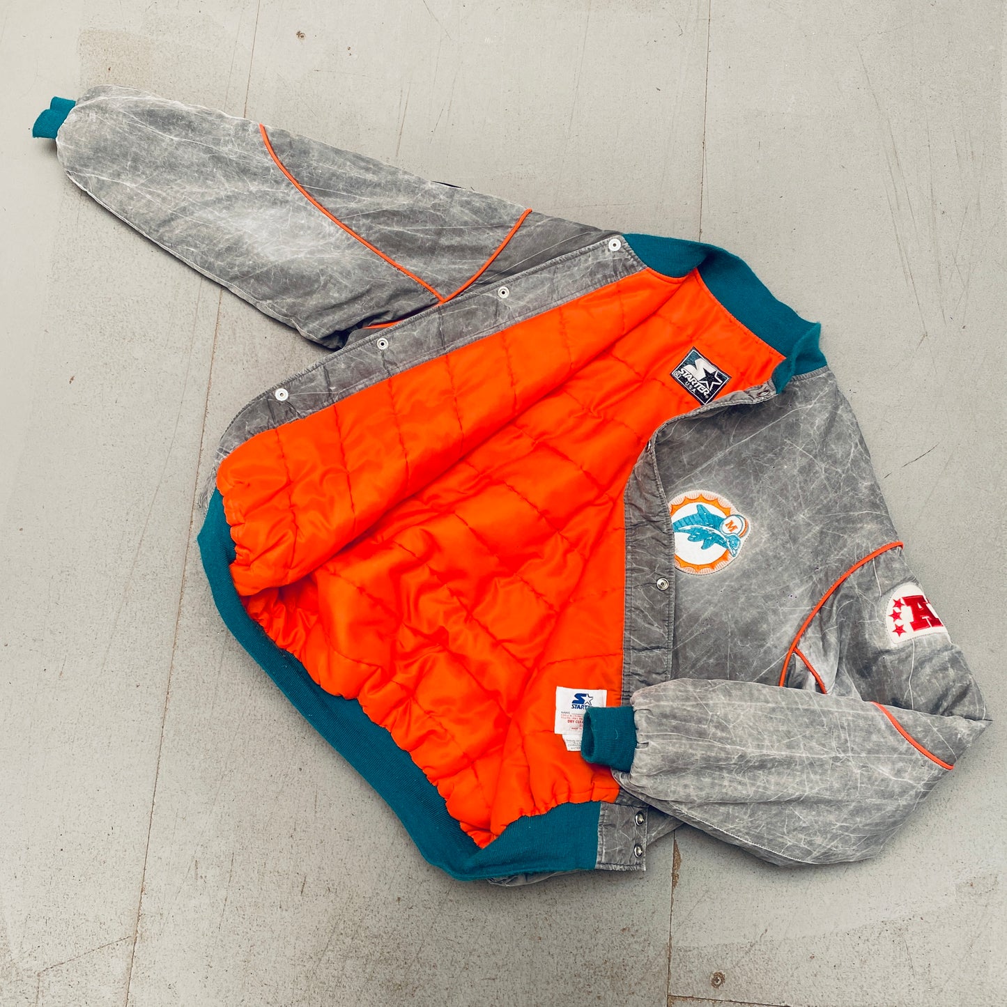 Miami Dolphins: 1990's Reverse Spellout Stone Wash Starter Bomber Jacket w/ NASA Patch (XL)