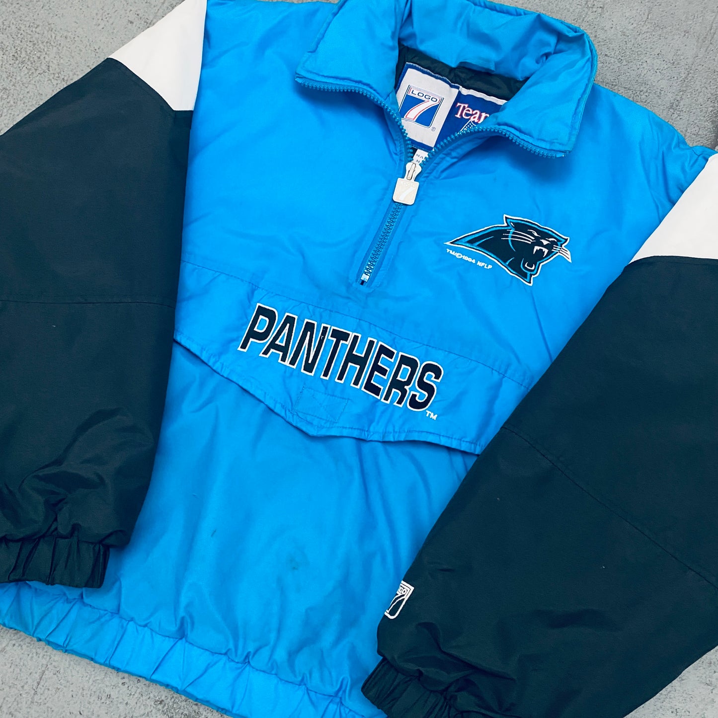 Carolina Panthers: 1994 Logo 7 Team Announce 1/4 Zip Breakaway Jacket (M)