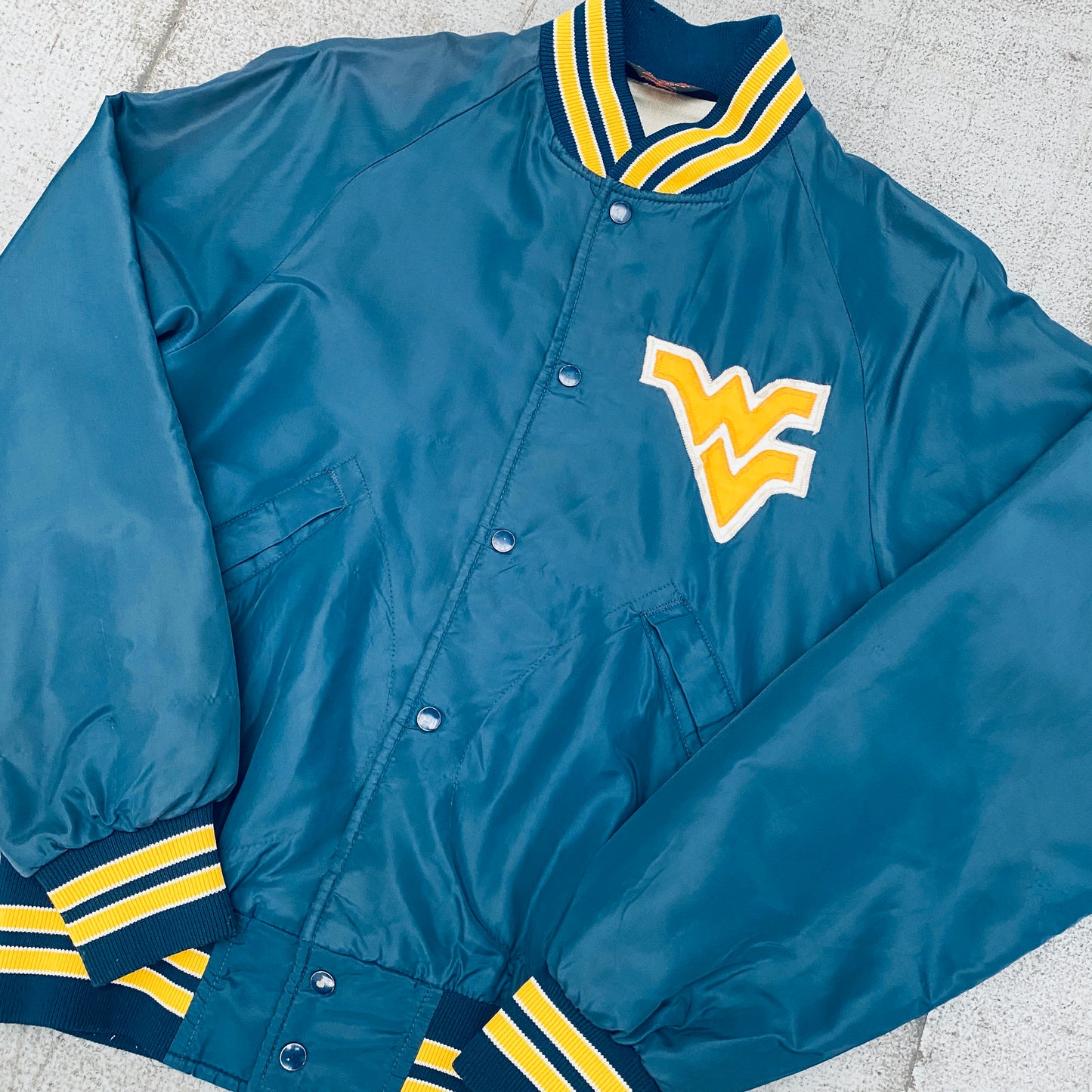 West Virginia Mountaineers: 1980's Satin Stitched Reverse Spellout Bomber Jacket (S)