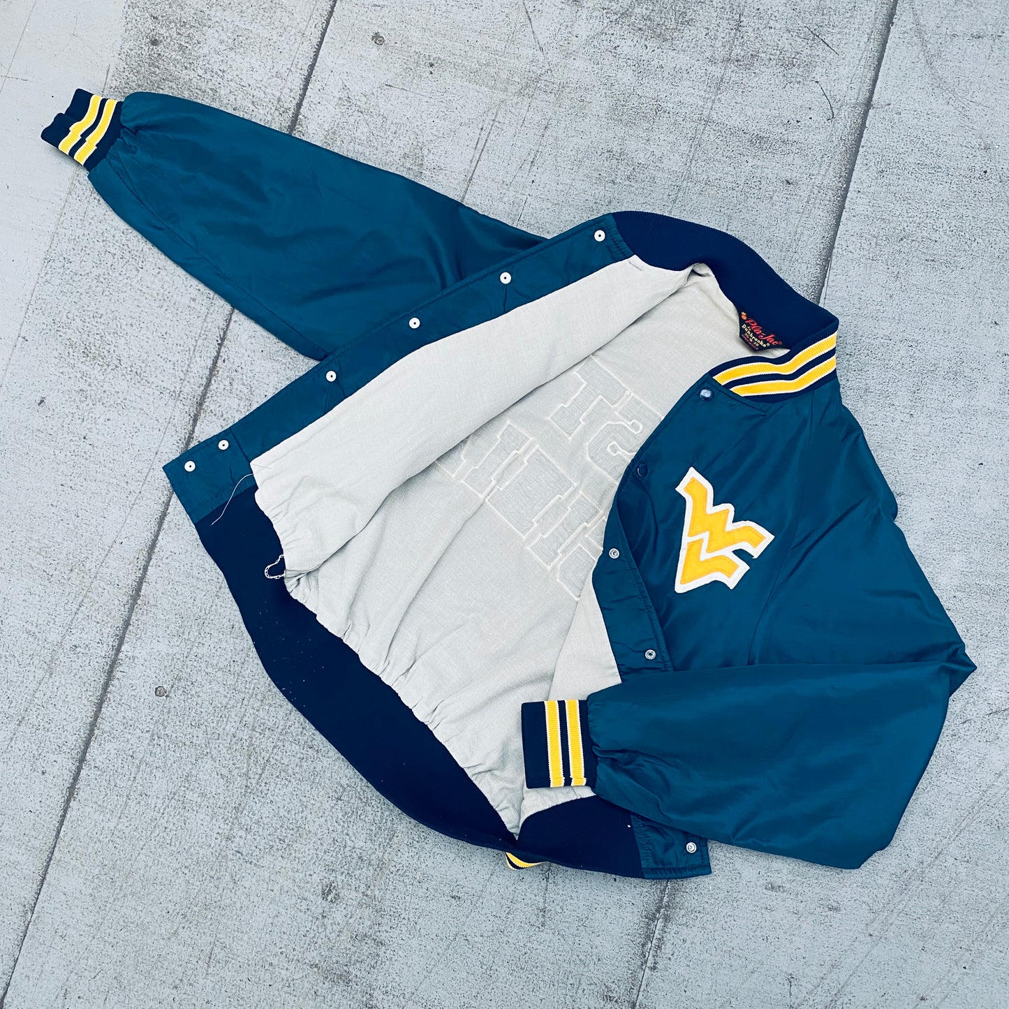 West Virginia Mountaineers: 1980's Satin Stitched Reverse Spellout Bomber Jacket (S)