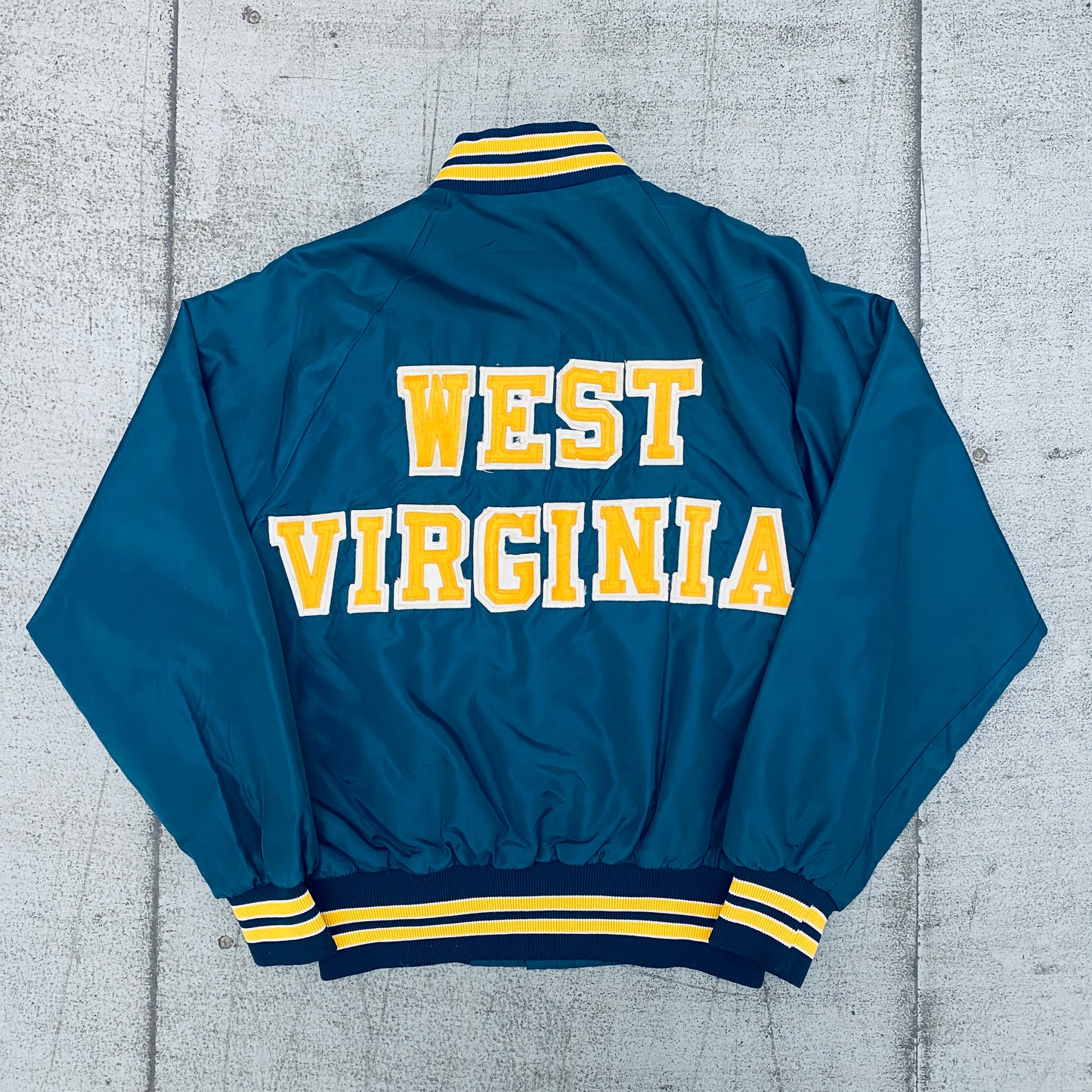 West Virginia Mountaineers: 1980's Satin Stitched Reverse Spellout Bomber Jacket (S)