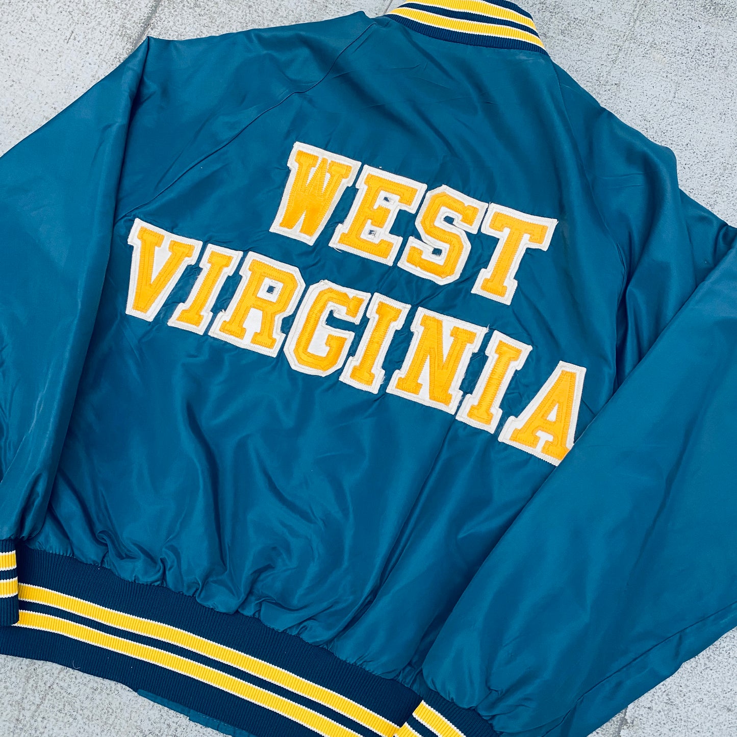 West Virginia Mountaineers: 1980's Satin Stitched Reverse Spellout Bomber Jacket (S)