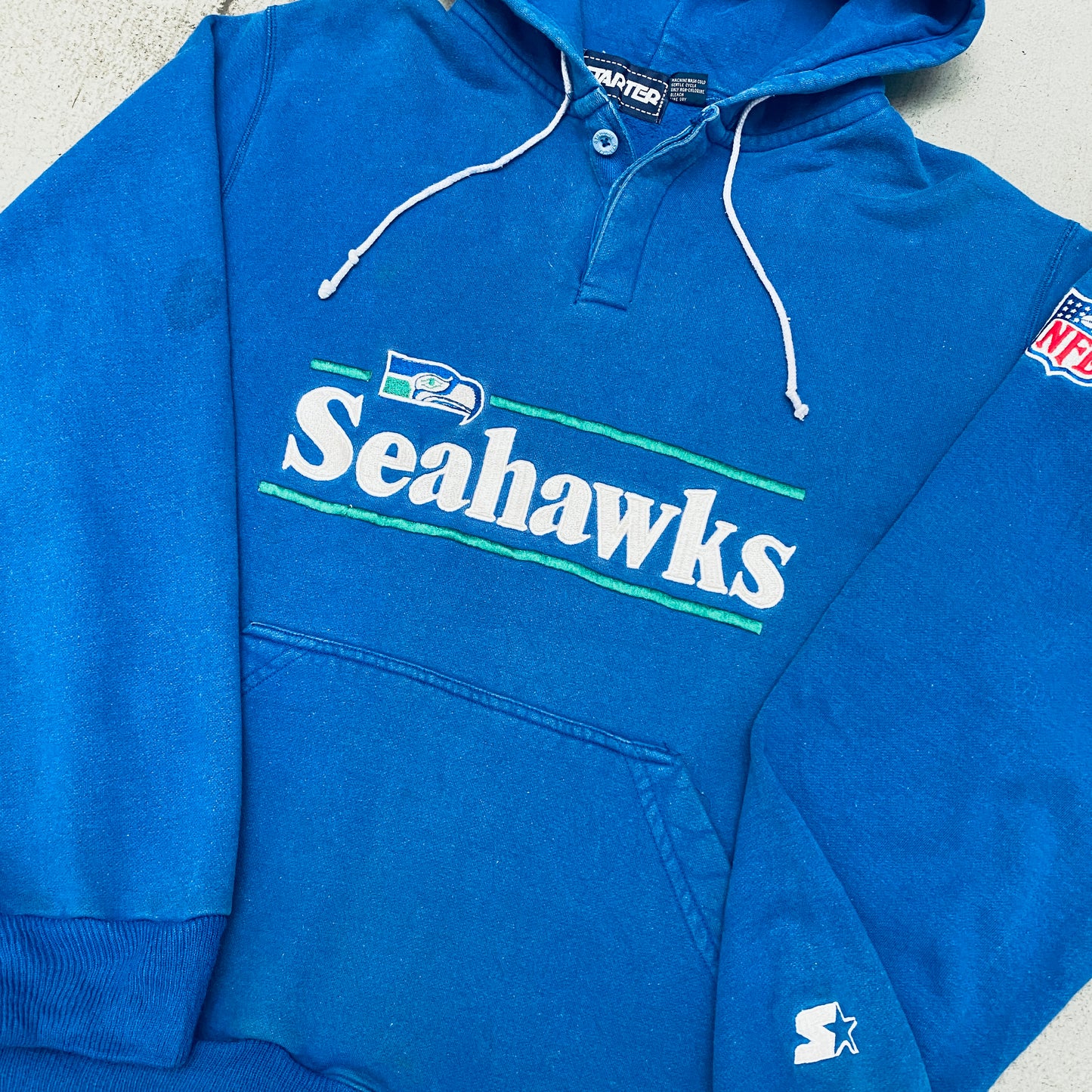 Seattle Seahawks: 1980's Embroidered Spellout Starter Hoodie (L)