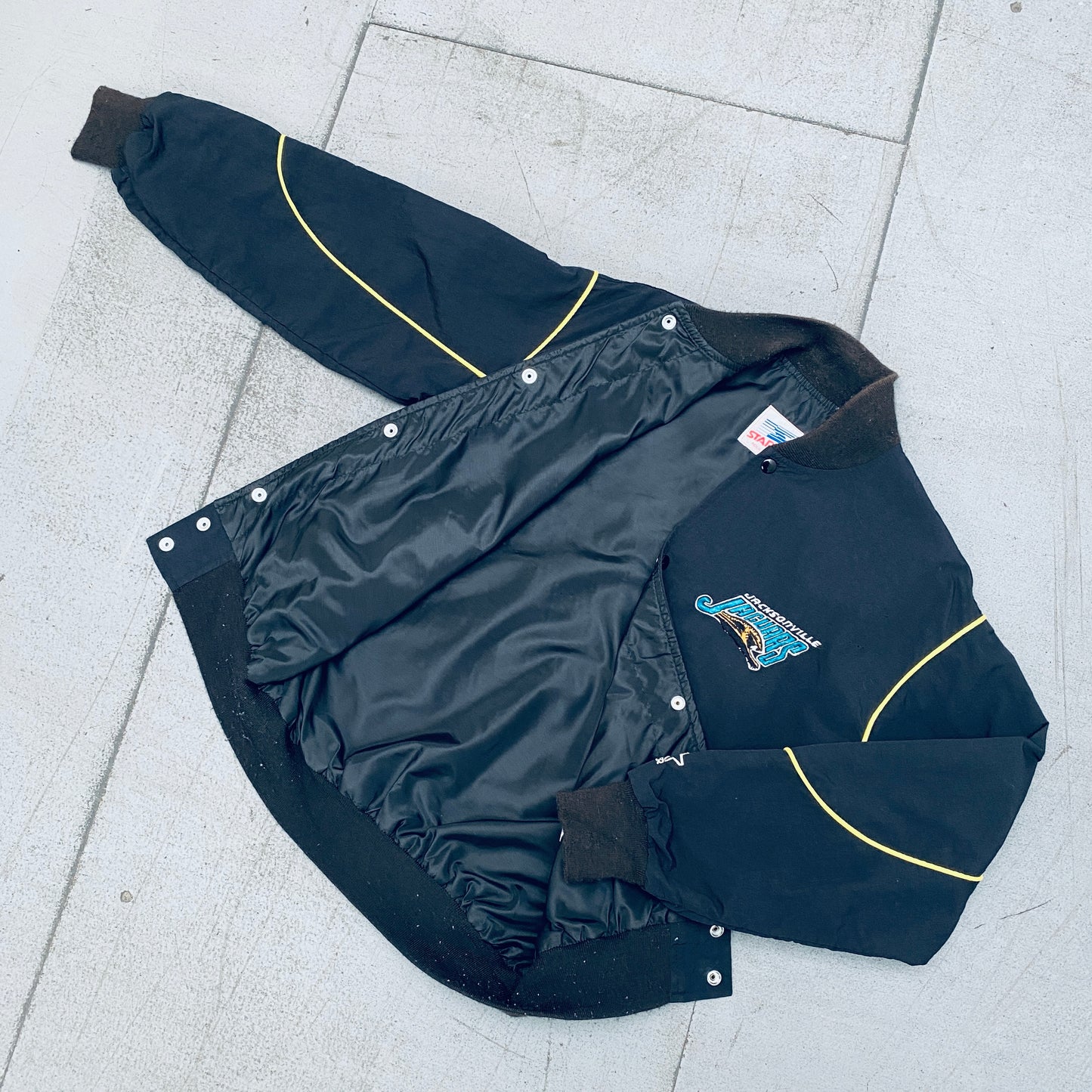 Jacksonville Jaguars: 1993 Blackout Team Announce Starter Bomber Jacket (M/L)