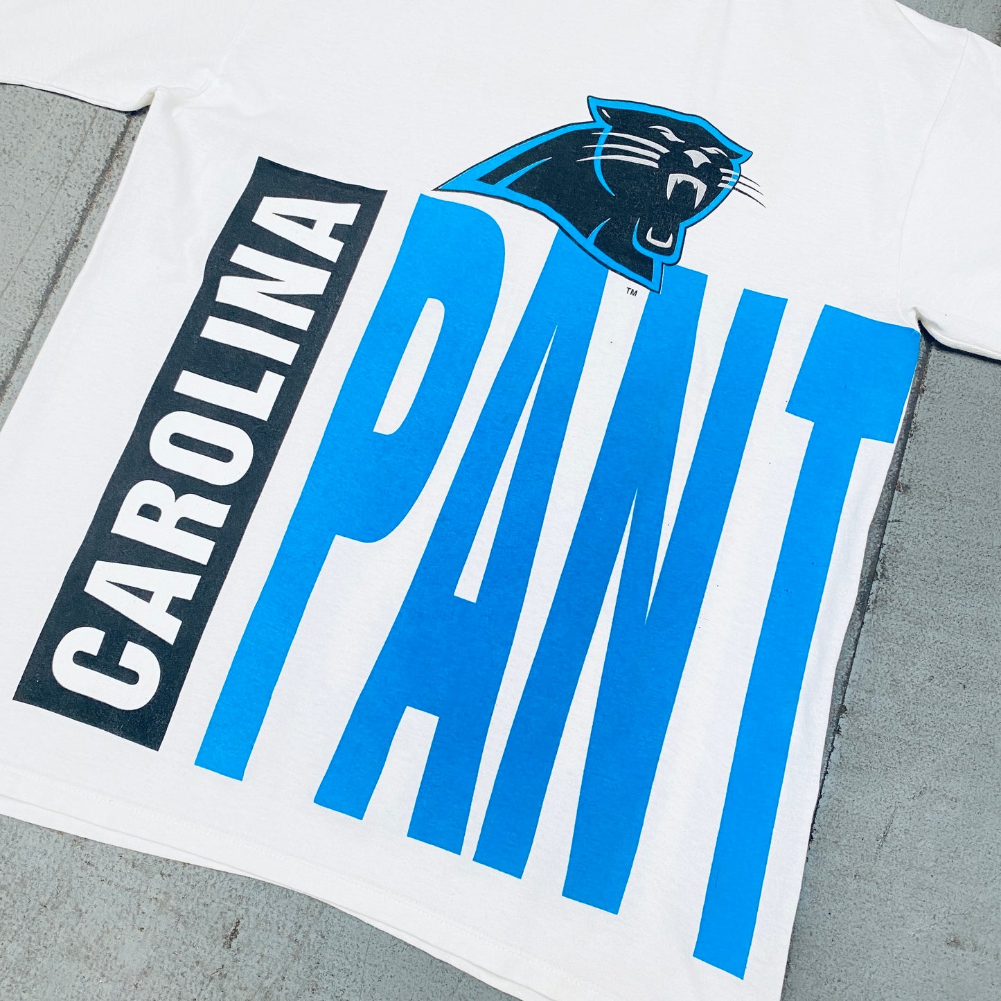 Carolina Panthers: 1993 Team Announce All Over Spellout Starter Tee (L)